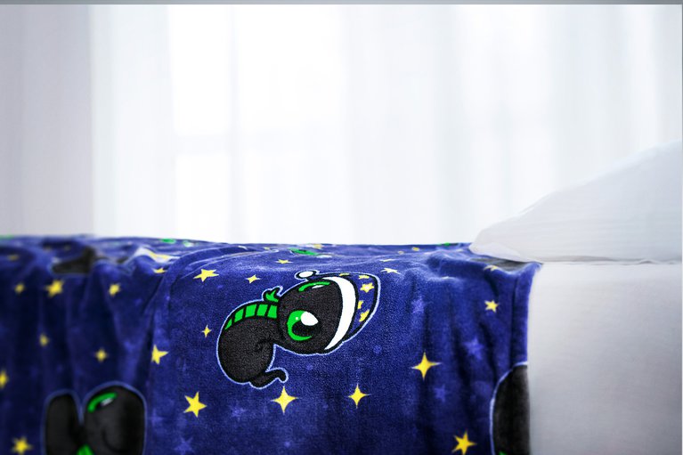 Razer Sneki Snek Fleece Blanket on bed closeup to showcase plush fabric texture